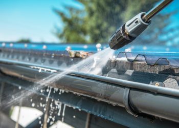 Spring,Rain,Gutters,Cleaning,Using,Pressure,Washer.,Closeup,Photo.